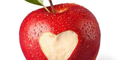 fresh red apple with heart symbol and leaf