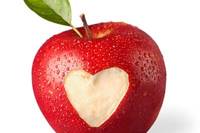 fresh red apple with heart symbol and leaf