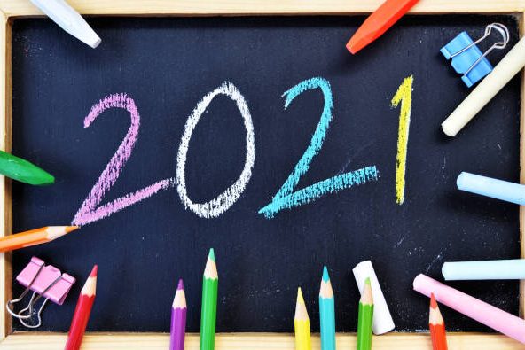 2021 Hand writing chalk on blackboard, Happy new year concept, back to school
